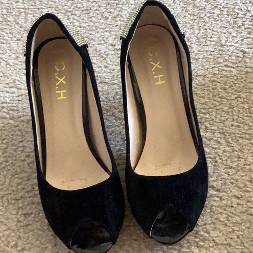 Black heels , never worn. Price is firm.